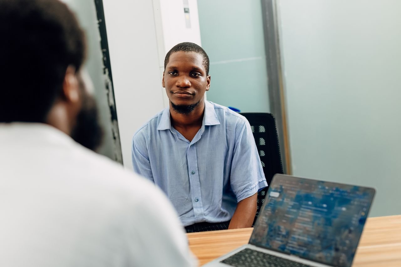 creative-approach-img A business meeting in a modern office in Lagos, Nigeria featuring two professionals engaged in a discussion.