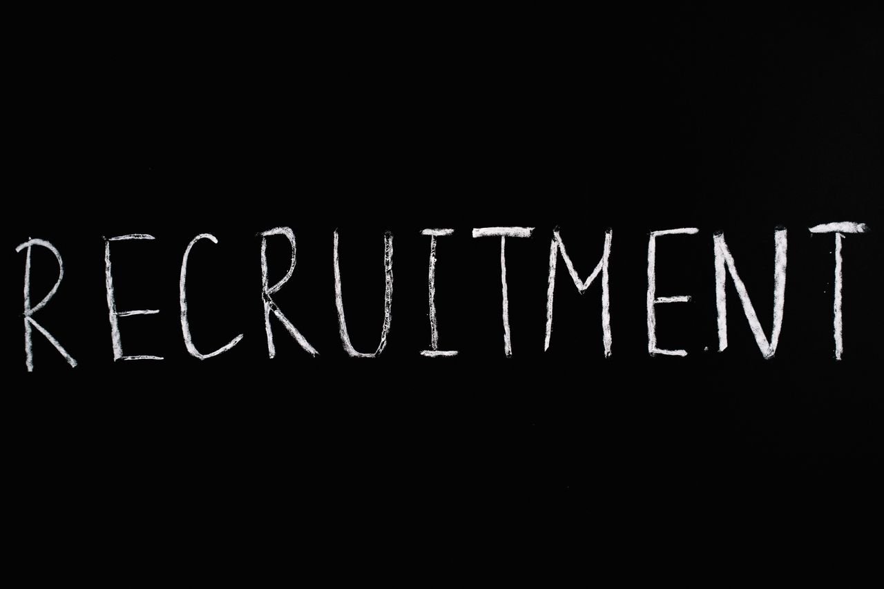 Crafting Captivating Headlines: Your awesome post title goes here Chalk-written 'RECRUITMENT' on a black chalkboard, ideal for HR and hiring themes.